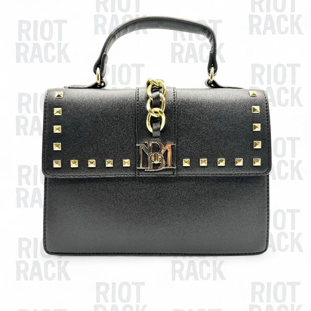 Luxury meets edge with this authentic Badgley Mischka handbag.